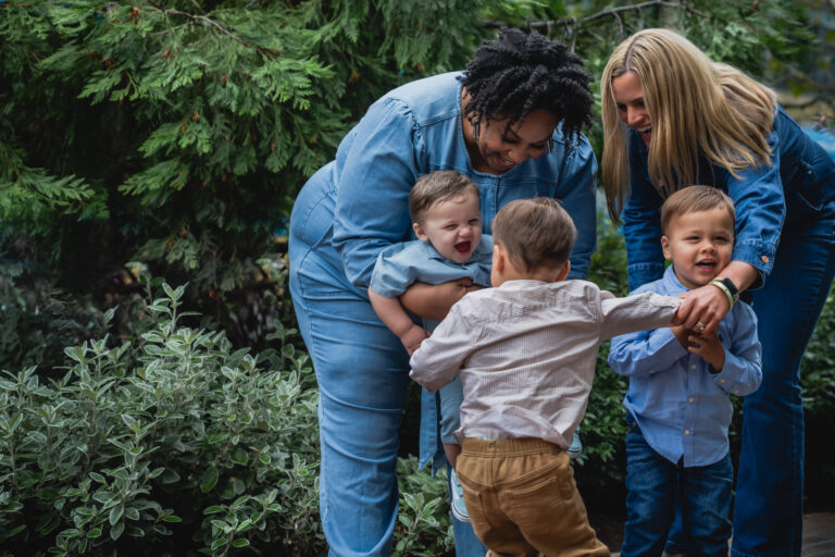 Tamika Felder and Ginny Marable are pictured with their three children, all born through fertility treatments, including embryo donation and surrogacy.