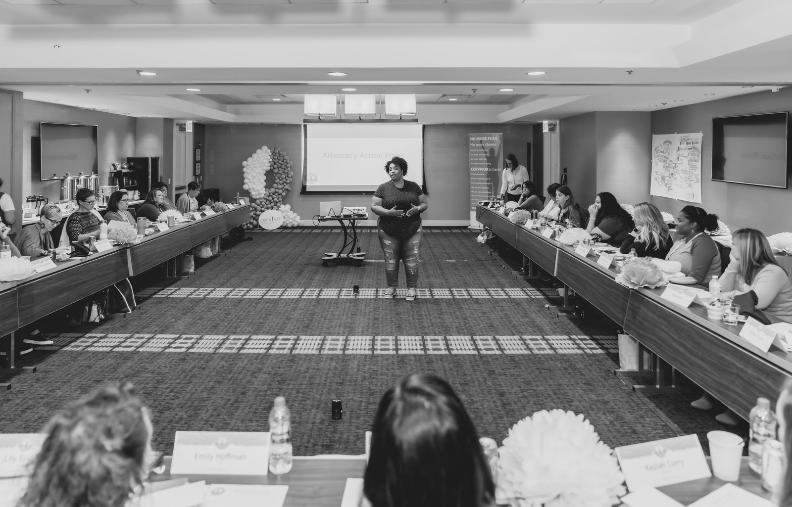 Tamika Felder, founder of Cervivor, Inc., speaks to a group of women at a 2024 Cervivor School event in New York, empowering them to advocate for cervical cancer prevention.